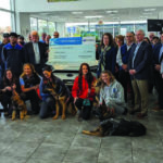 Suburban Subaru check presentation to Fidelco